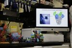 A model of a coronavirus vaccine design is seen on a screen at the Viral Pathogenesis Laboratory at the National Institutes of Health Vaccine Research Center in Bethesda.