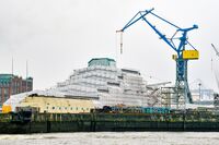 The Dilbar superyacht under cover while undergoing refitting at the Blohm & Voss dock in Hamburg, Germany, on March 4.