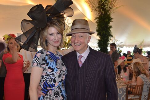 Lizzie Tisch and milliner Stephen Jones. Photographer: Amanda Gordon/Bloomberg