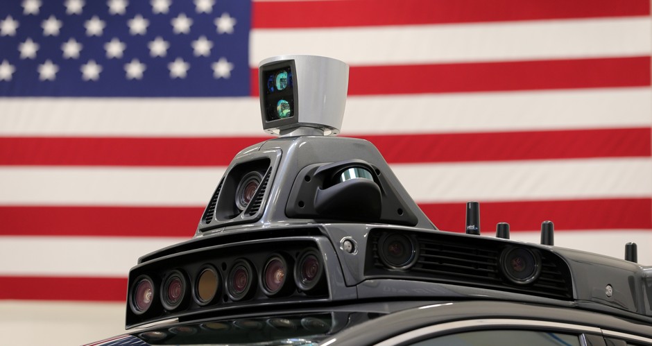 A roof mounted camera and radar system on Uber's self-driving Ford Fusion