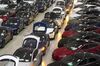 A line of new Tesla Model X sports utility vehicles (SUV), center, sit with Tesla Model S automobiles following assembly for the European market at the Tesla Motors Inc. factory in Tilburg, Netherlands, on Friday, Dec. 9, 2016. A boom in electric vehicles made by the likes of Tesla could erode as much as 10 percent of global gasoline demand by 2035, according to the oil industry consultant Wood Mackenzie Ltd.