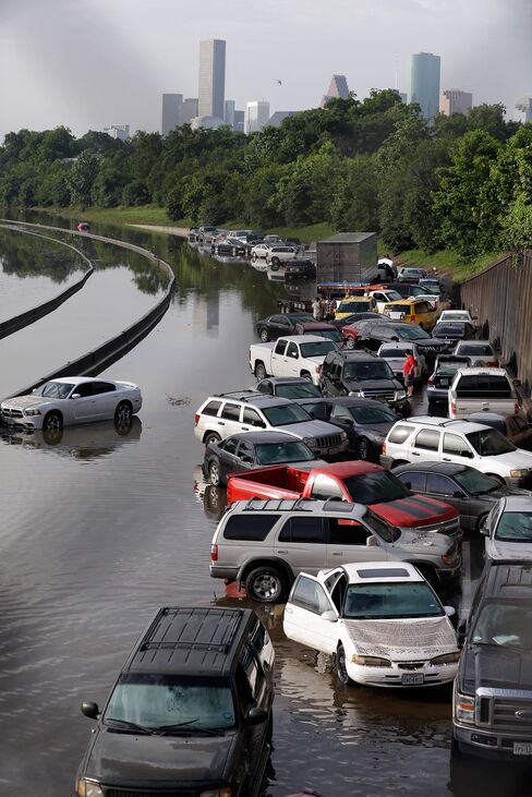 Cars remain stranded along a flooded section of Interstate 45 after heavy rains overnight in Houston, Tuesday, May 26, 2015. Several major highways are closed in the Houston area due to high water.