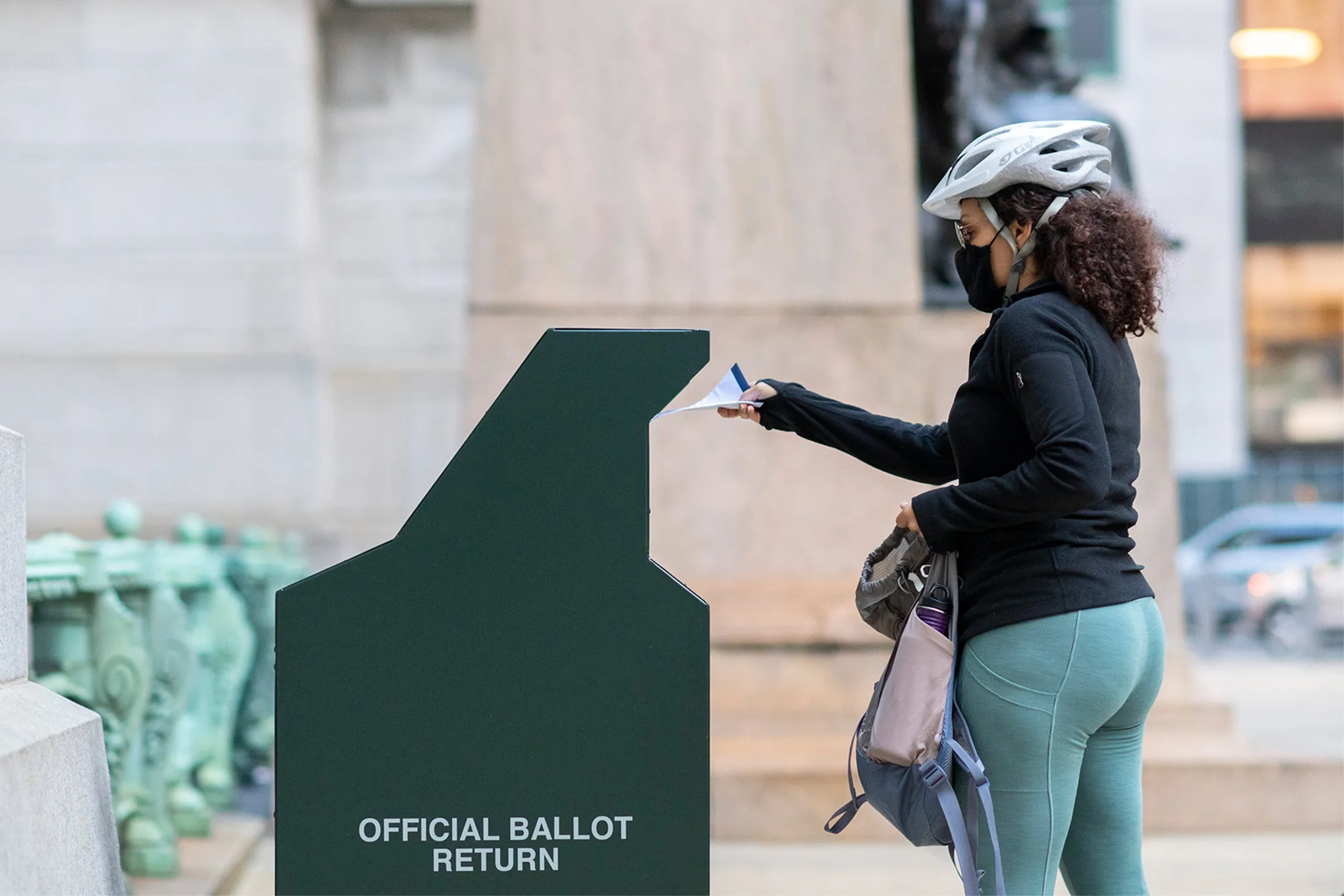 A voter casts their early voting ballot at drop box outside of City Hall in Philadelphia, Pennsylvania, on Oct. 17.