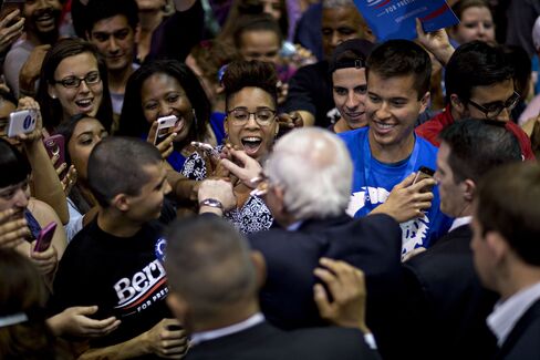 Senator Bernie Sanders greets attendees at a campaign rally in Tampa.