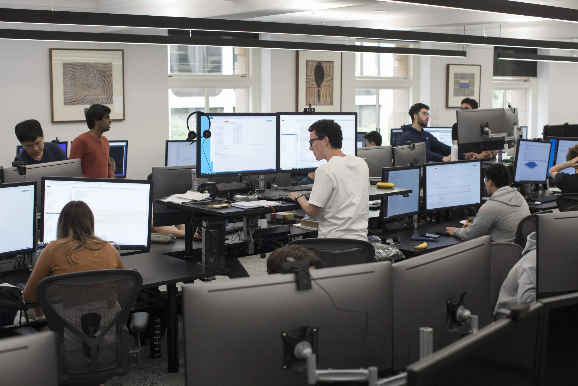 Interns work at computers at the Optiver office in Sydney.