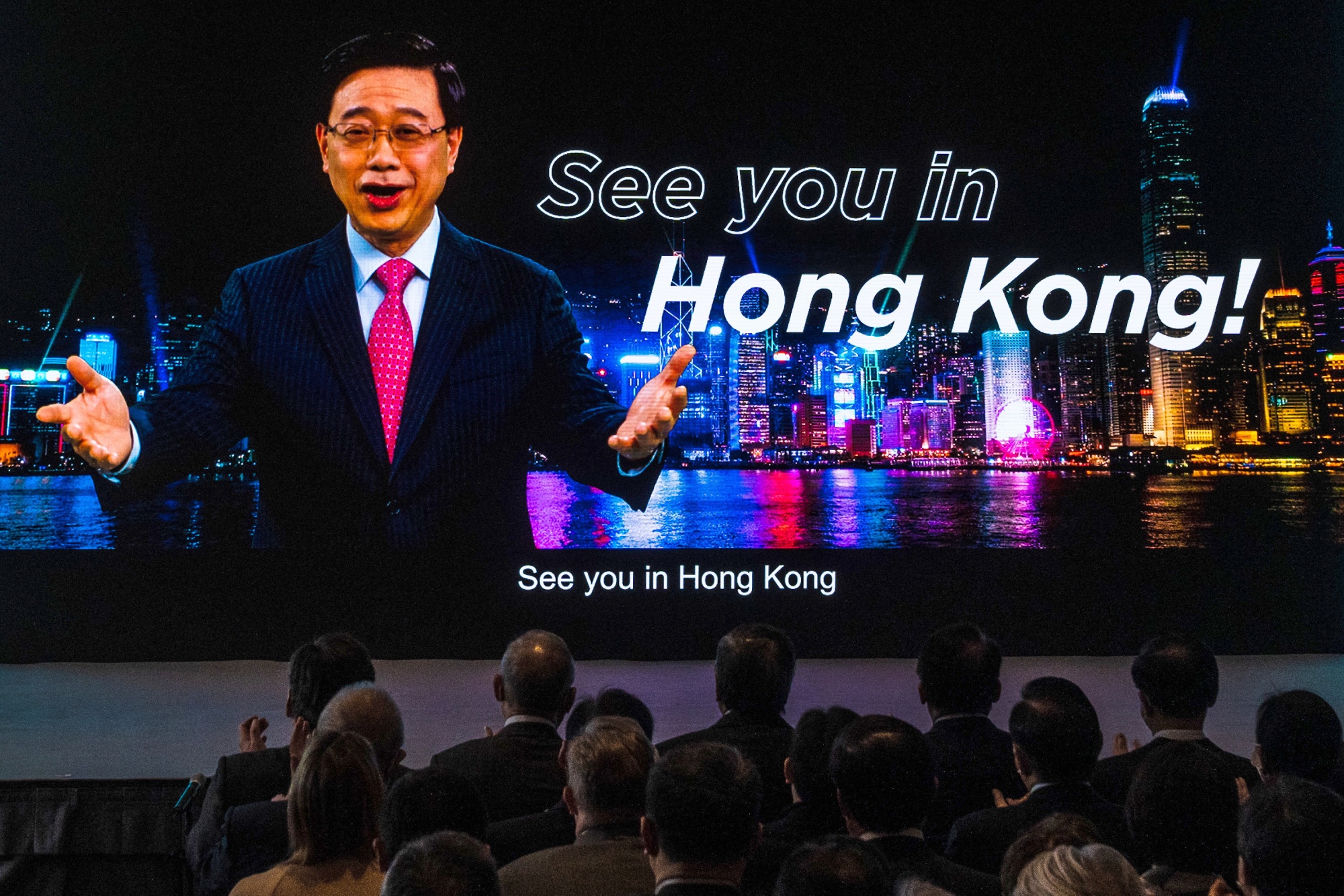 A promotional video featuring John Lee, Hong Kong’s chief executive, on a screen during the Hello Hong Kong campaign launch ceremony.