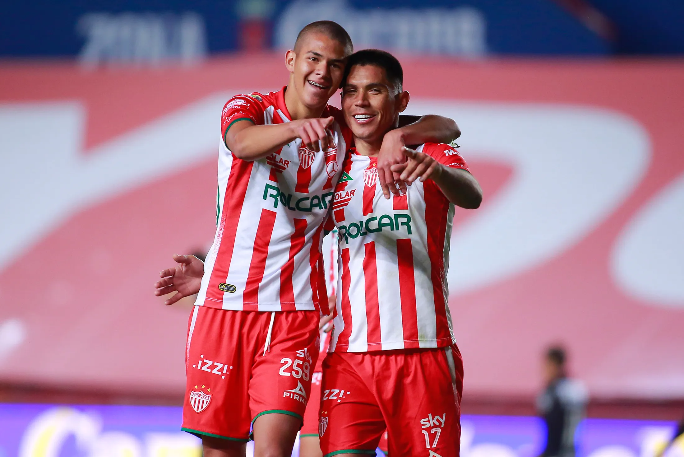 Martin Barragan of Necaxa (right) celebrates after scoring against Monterrey during their Mexican Clausura football tournament match at Victoria Stadium in Aguascalientes, Mexico, on Feb. 19, 2021.&nbsp;