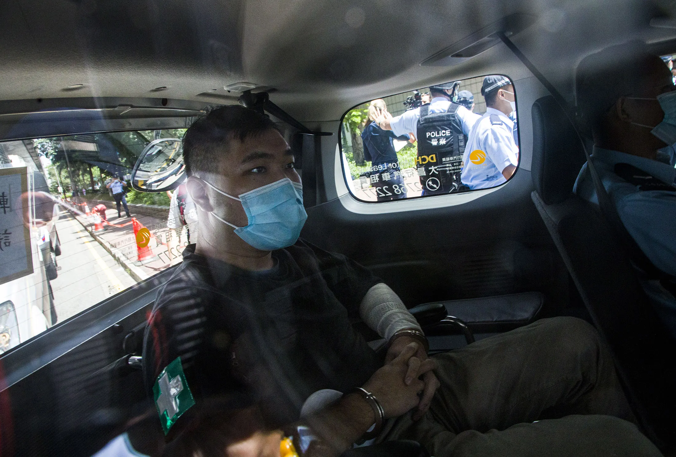 Tong Ying-Kit arrives at court, after being accused of deliberately driving his motorcycle into a group of police officers, in Hong Kong on July 6.