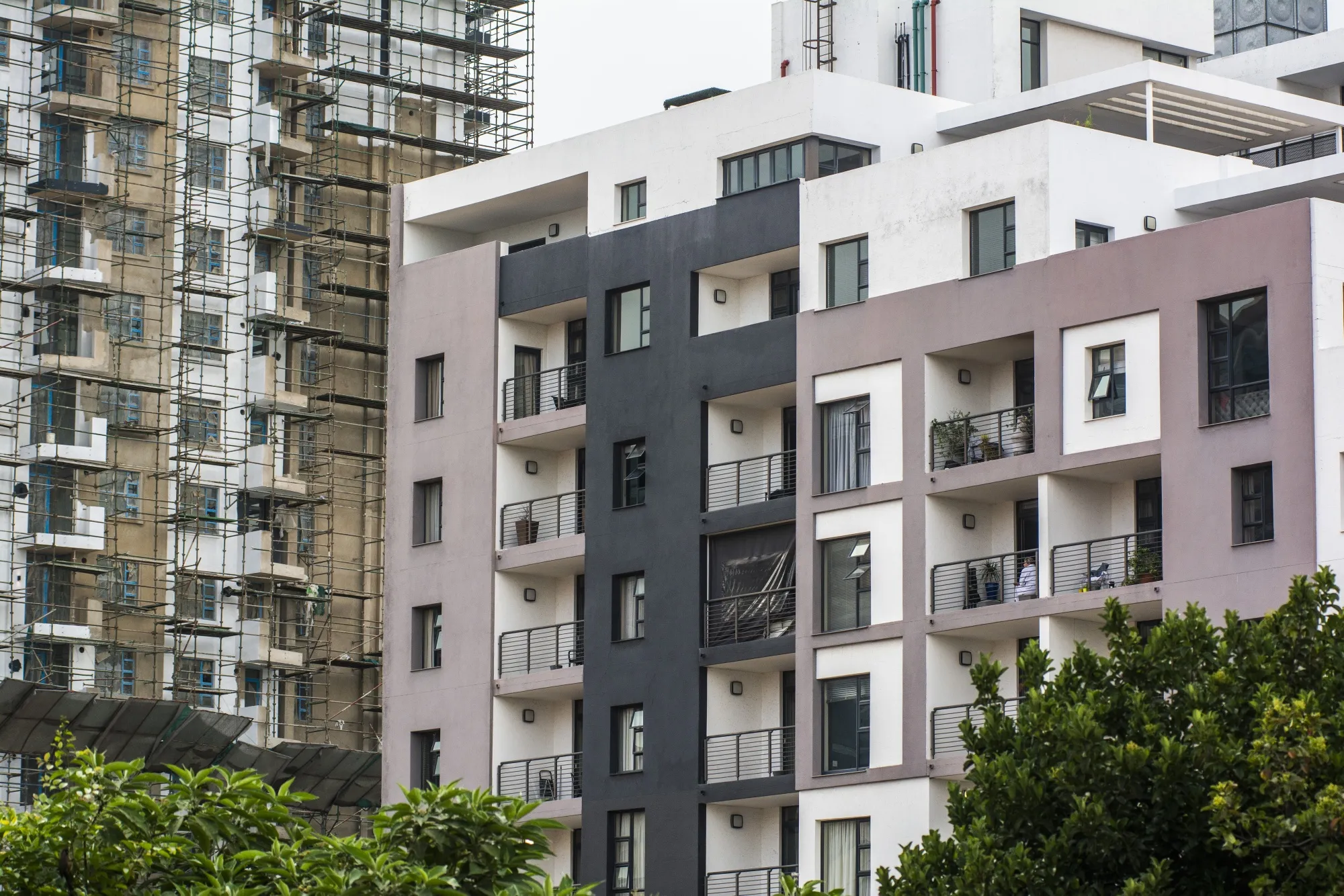 A residential building under construction next to an apartment block in Johannesburg, South Africa.