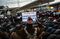 A group of Muslim men pray while supporters hold up signs during an interfaith prayer and rally at John F. Kennedy Airport (JFK) to protest U.S. President Donald Trump's travel ban on immigrants and refugees from seven nations in New York, U.S., on Friday, Feb. 3, 2017. Trump's edict, signed without advance notice on Jan. 27, threw airports across America into turmoil as travelers from the affected countries who were already en route to the U.S. learned upon deplaning that they couldn't leave the airport. Some of those people were lawful U.S. residents holding so-called green cards and work visas. Photographer: Kholood Eid/Bloomberg via Getty Images