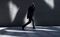 A pedestrian walks through reflections of light in the City of London U.K., on Wednesday, June 14, 2017. The squeeze on U.K. households intensified in the three months through April as weaker wage growth inflicted the biggest loss of purchasing power in almost three years. Photographer: Chris J. Ratcliffe/Bloomberg