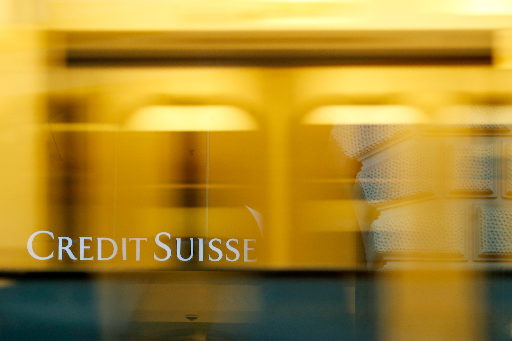 A tram passes Credit Suisse Group headquarters in Zurich.