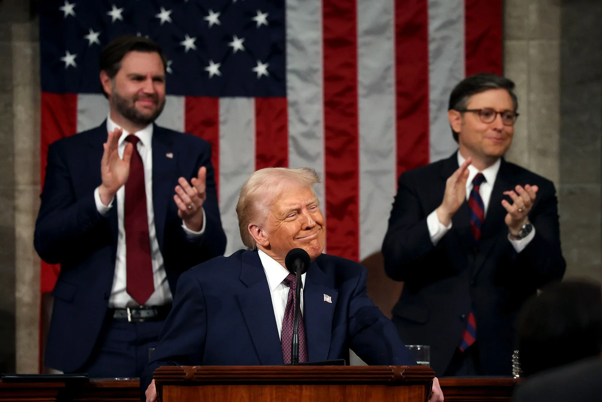 US President Donald Trump, flanked by Vice President JD Vance and US House Speaker Mike Johnson, during a joint session of Congress.
