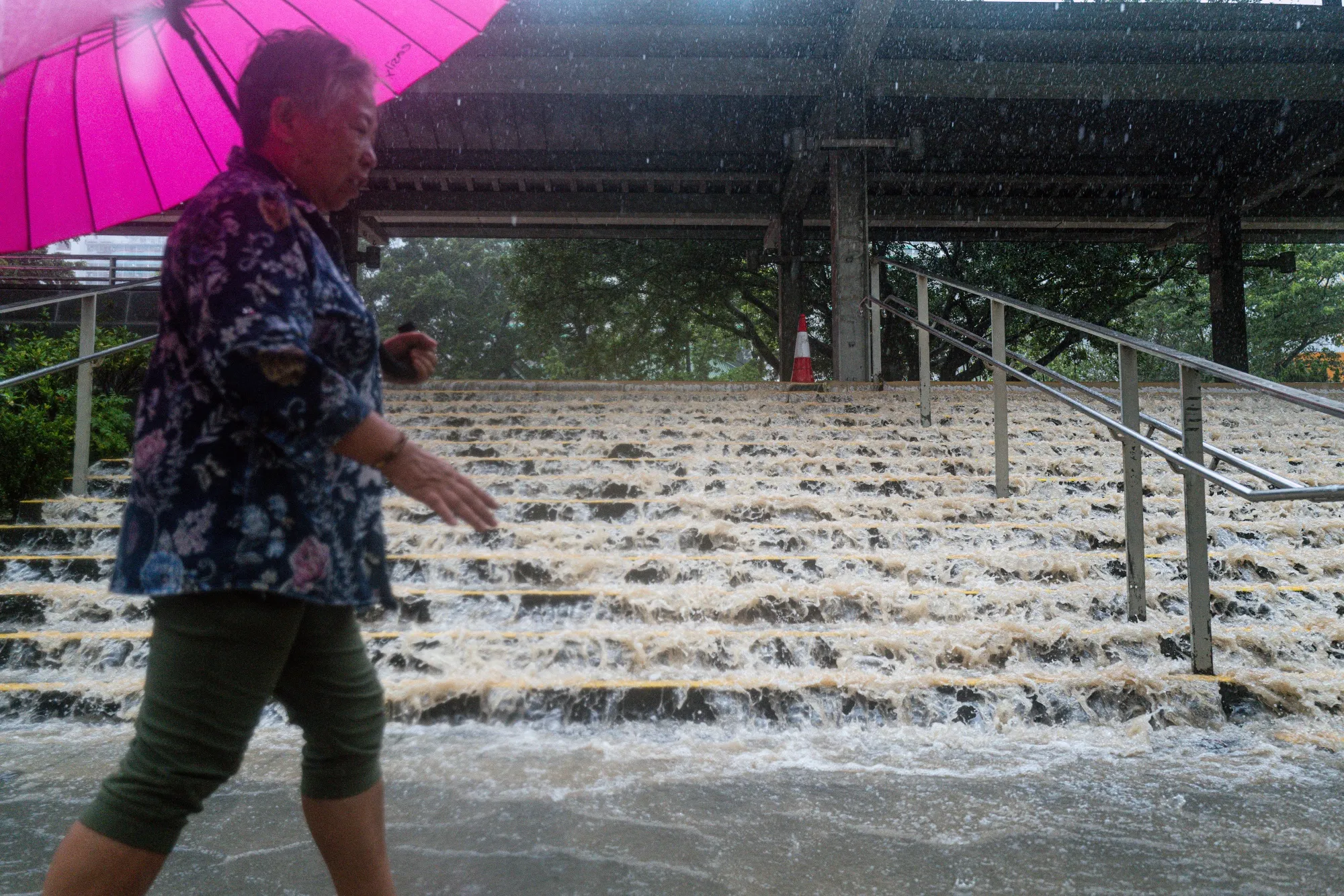 Floodwaters inundate a flight of steps during heavy rain in Hong Kong on Sept. 8.