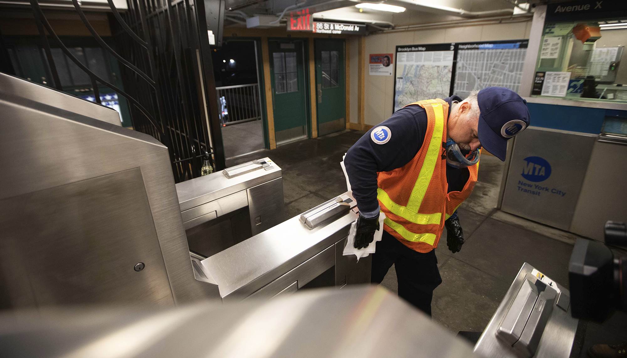 A Metropolitan Transportation Authority worker sanitizes surfaces at the Avenue X subway station in the Brooklyn borough of New York.