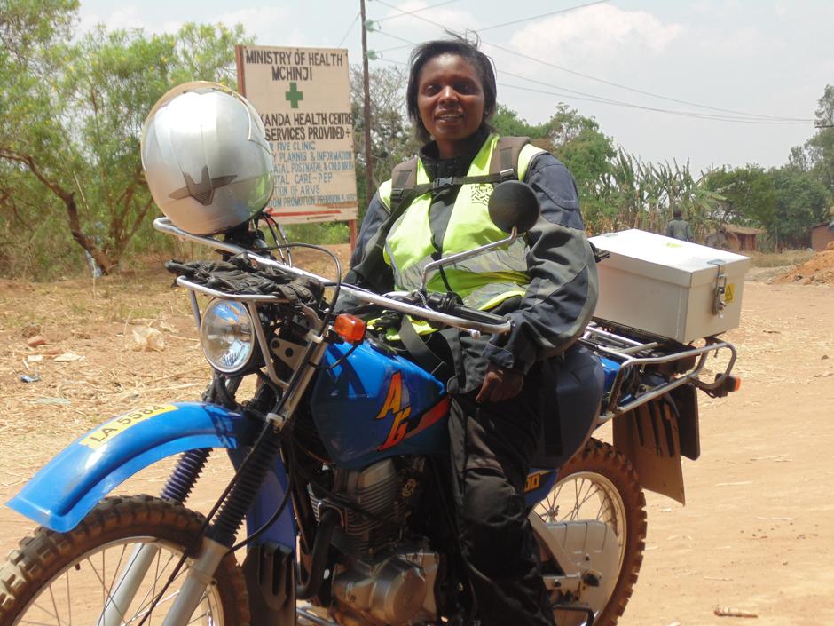 A courier waits to take samples from a facility in rural Malawi to the main district lab. 