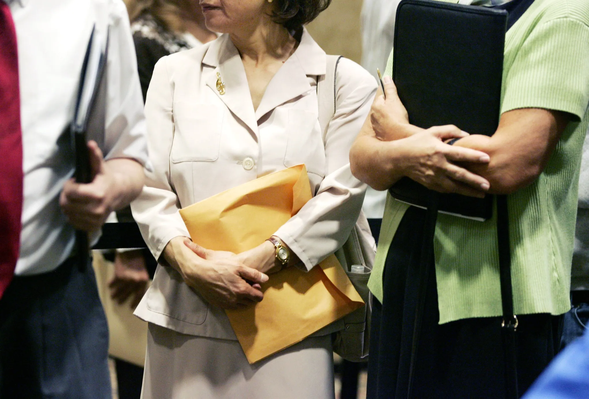 Job seekers wait in line during a job fair in Las Vegas.