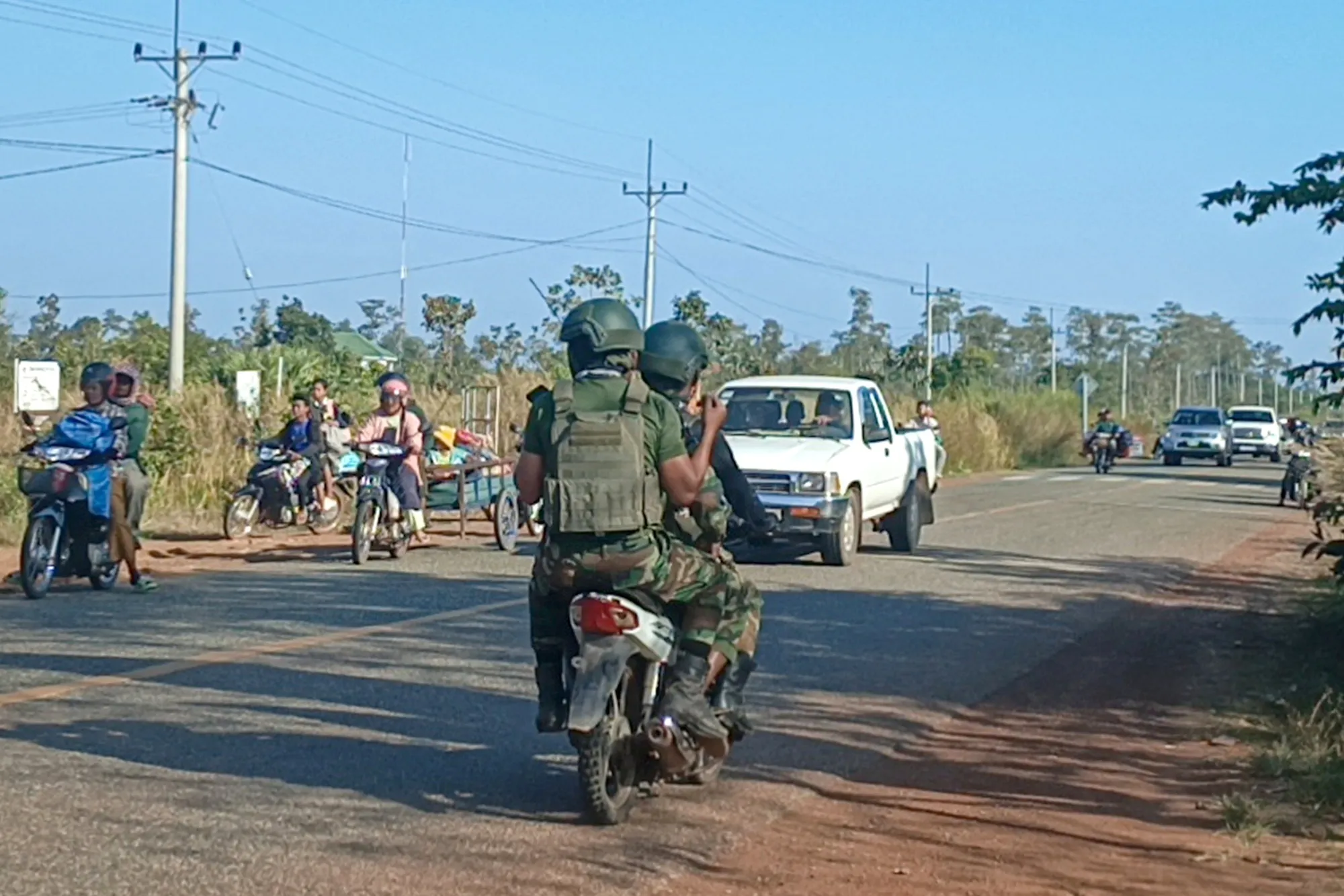 Cambodian soldiers and fleeing residents head in opposite directions amid new clashes with Thailand.