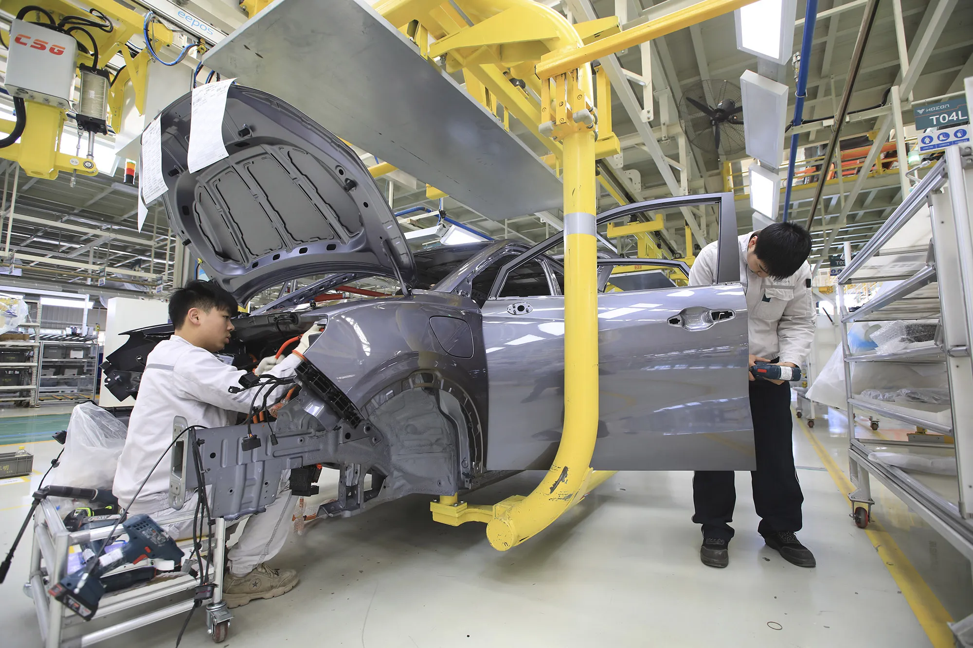 The assembly line of a Neta electric car at a factory of Hozon New Energy Automobile Co.,&nbsp;in Jiaxing,