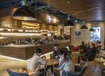 Customers sit at tables in a Luckin Coffee outlet in Beijing.