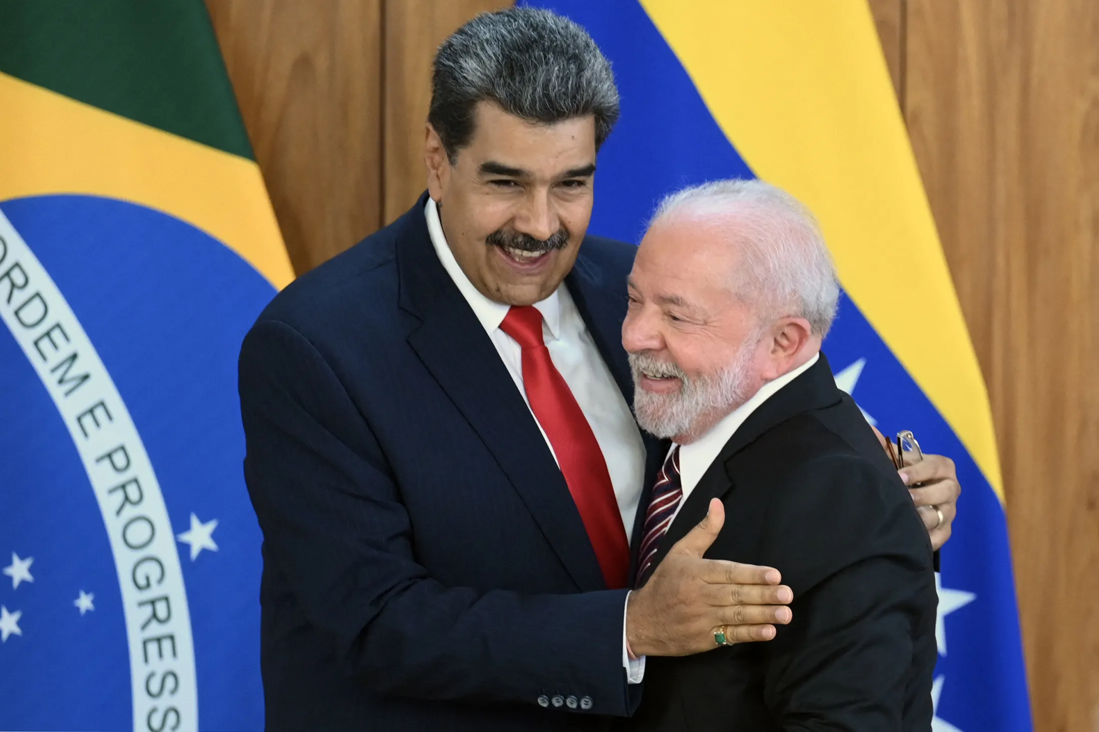 Nicolas Maduro and Lula greet each other after a joint press conference at the Planalto Palace in Brasilia on May 29, 2023.