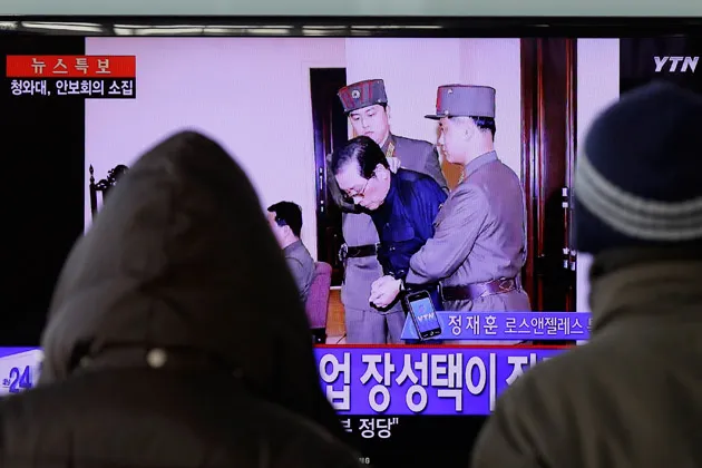 Jang Song Thaek is escorted by military officers during a trial in Pyongyang, North Korea, on Dec. 12, 2013