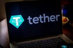 The Tether logo on a laptop computer arranged in Dobbs Ferry, New York, U.S., on Saturday, May 22, 2021. Elon Musk continued to toy with the price of Bitcoin Monday, taking to Twitter to indicate support for what he says is an effort by miners to make their operations greener.
