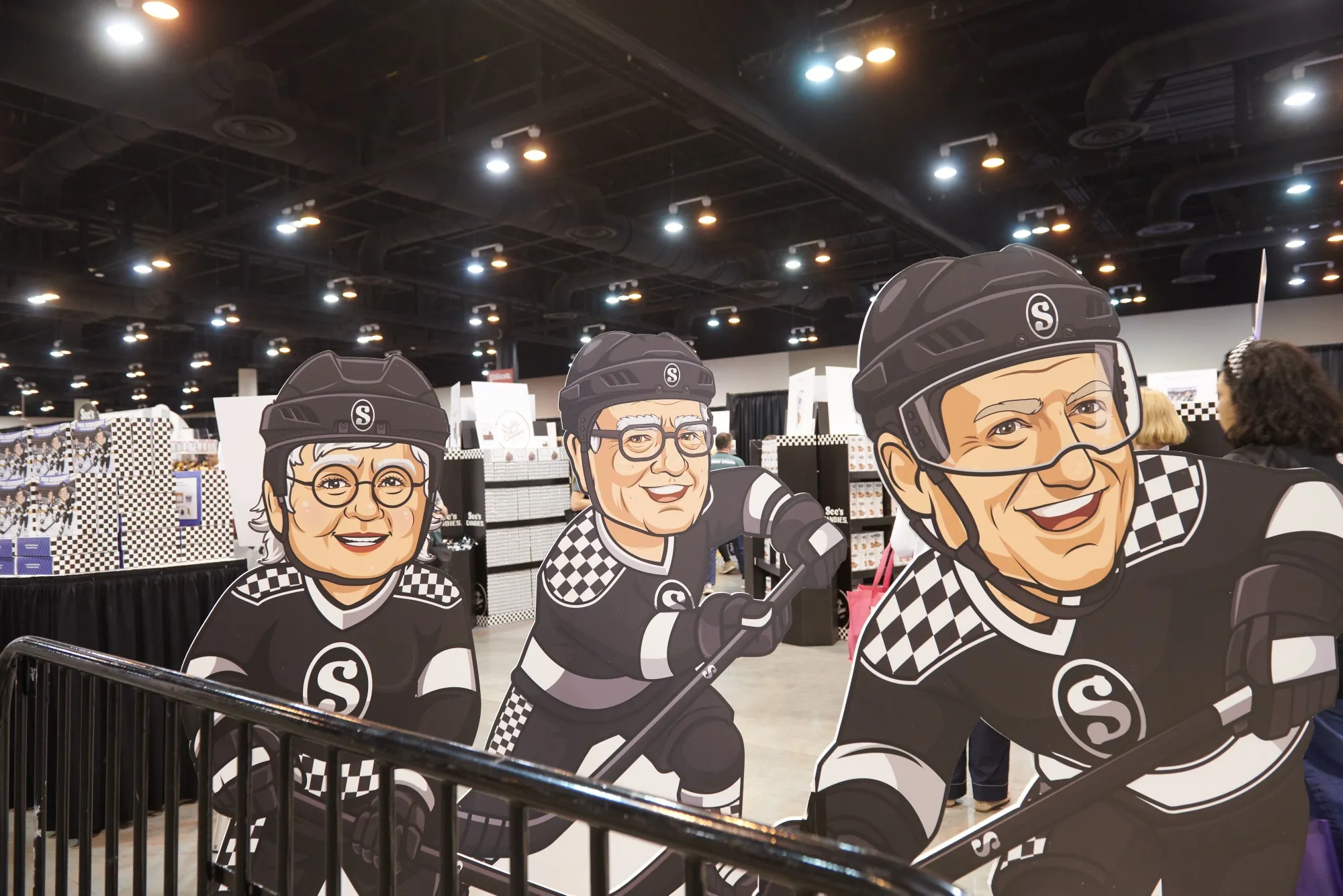 Game on: Cutouts of Berkshire CEO Greg Abel, Warren Buffett&nbsp;and&nbsp;See’s Candies co-founder Mary See.