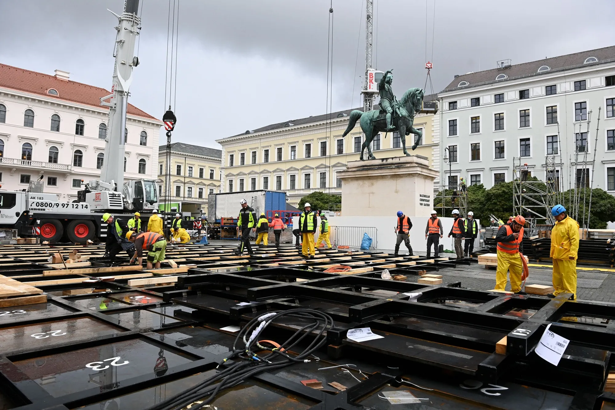 Employees work on an outside exhibition area for the upcoming IAA motor show&nbsp;in Munich.