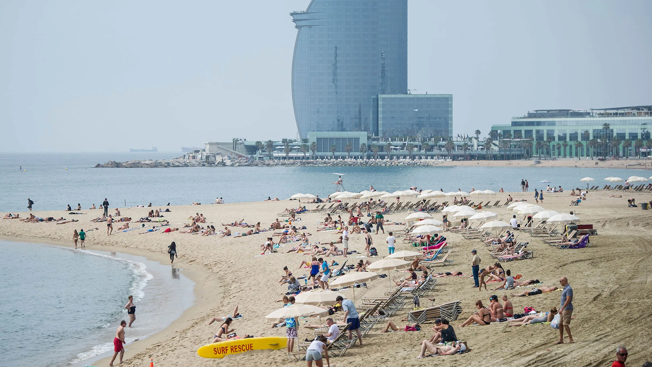 Visitors sunbathe at La Marbella beach in Barcelona.

