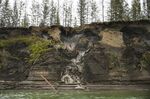 Permafrost, seen at the top of the cliff, melts into the Kolyma River outside of Zyryanka, Russia on July 4, 2019.&nbsp;