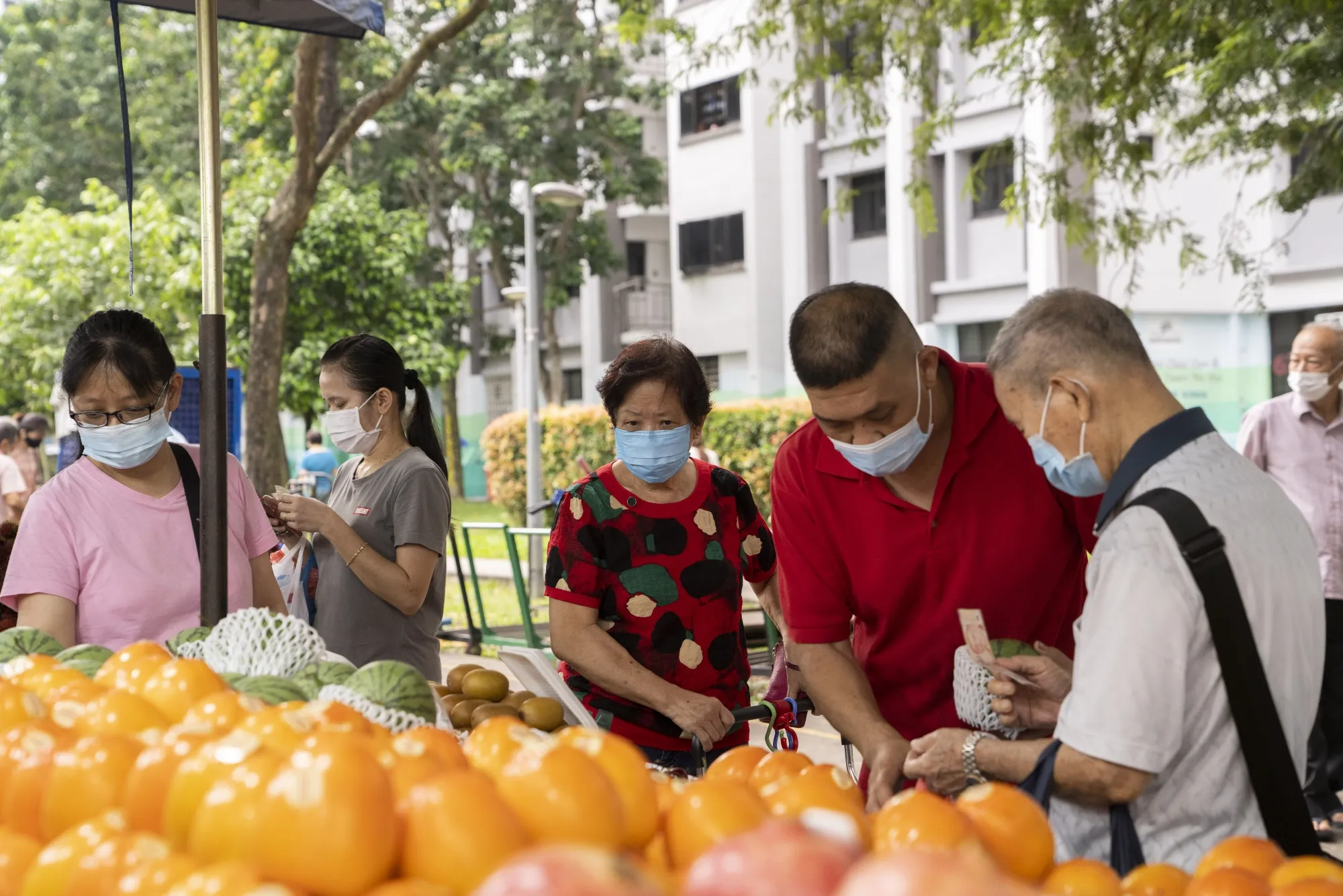 Shoppers at a market in Singapore.&nbsp;