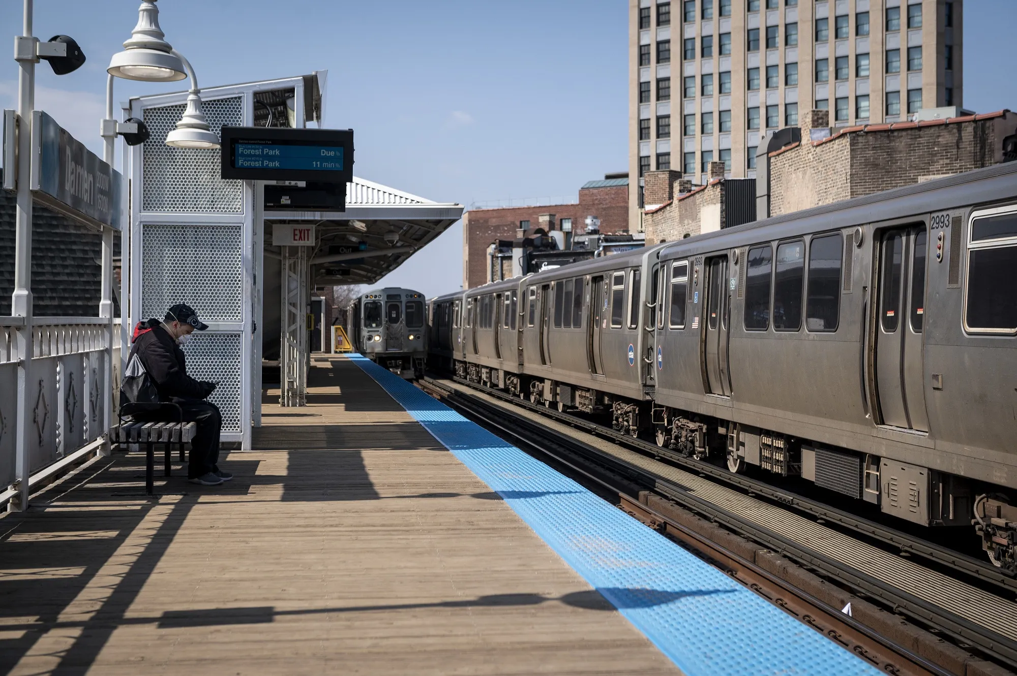 A man waits for a train in Chicago on April 3.