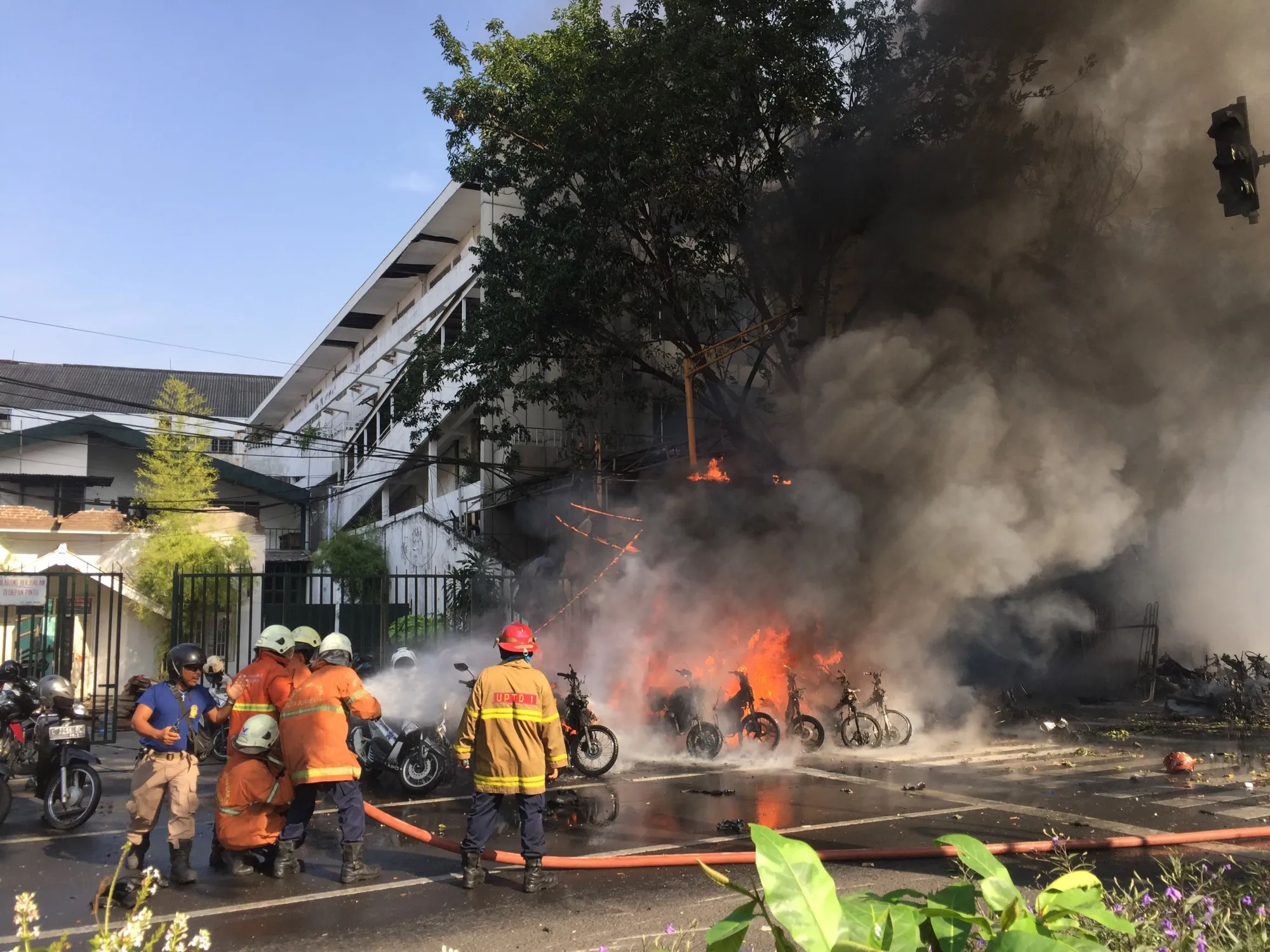 Fire rescue workers work at bomb blast at Surabaya Pantekosta Center Church in Surabaya, Indonesia&nbsp;on May 13.