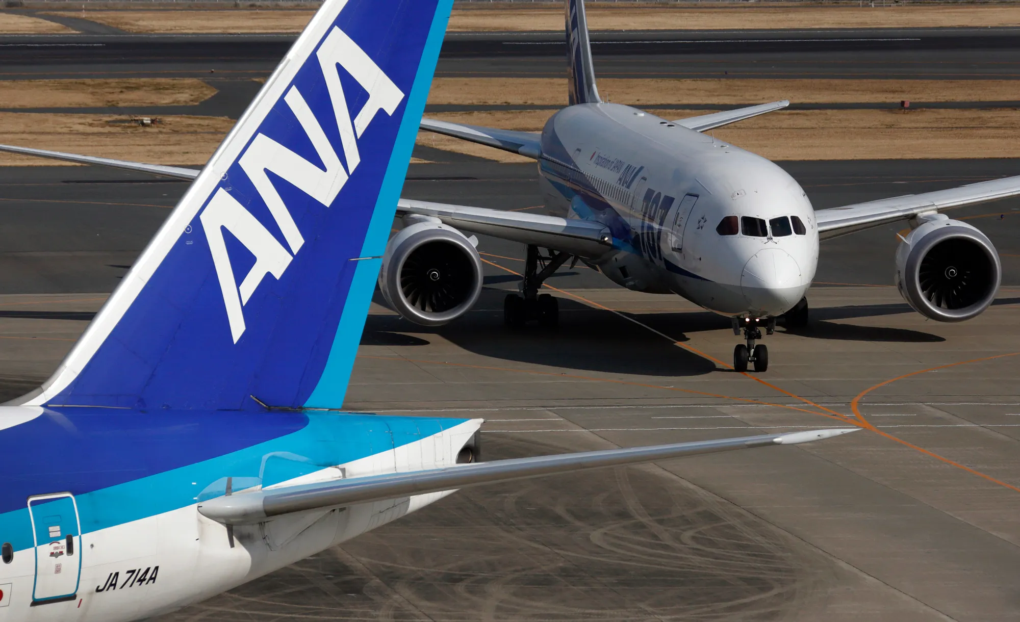 All Nippon Airways Co. (ANA) aircraft taxi at Haneda Airport in Tokyo.
