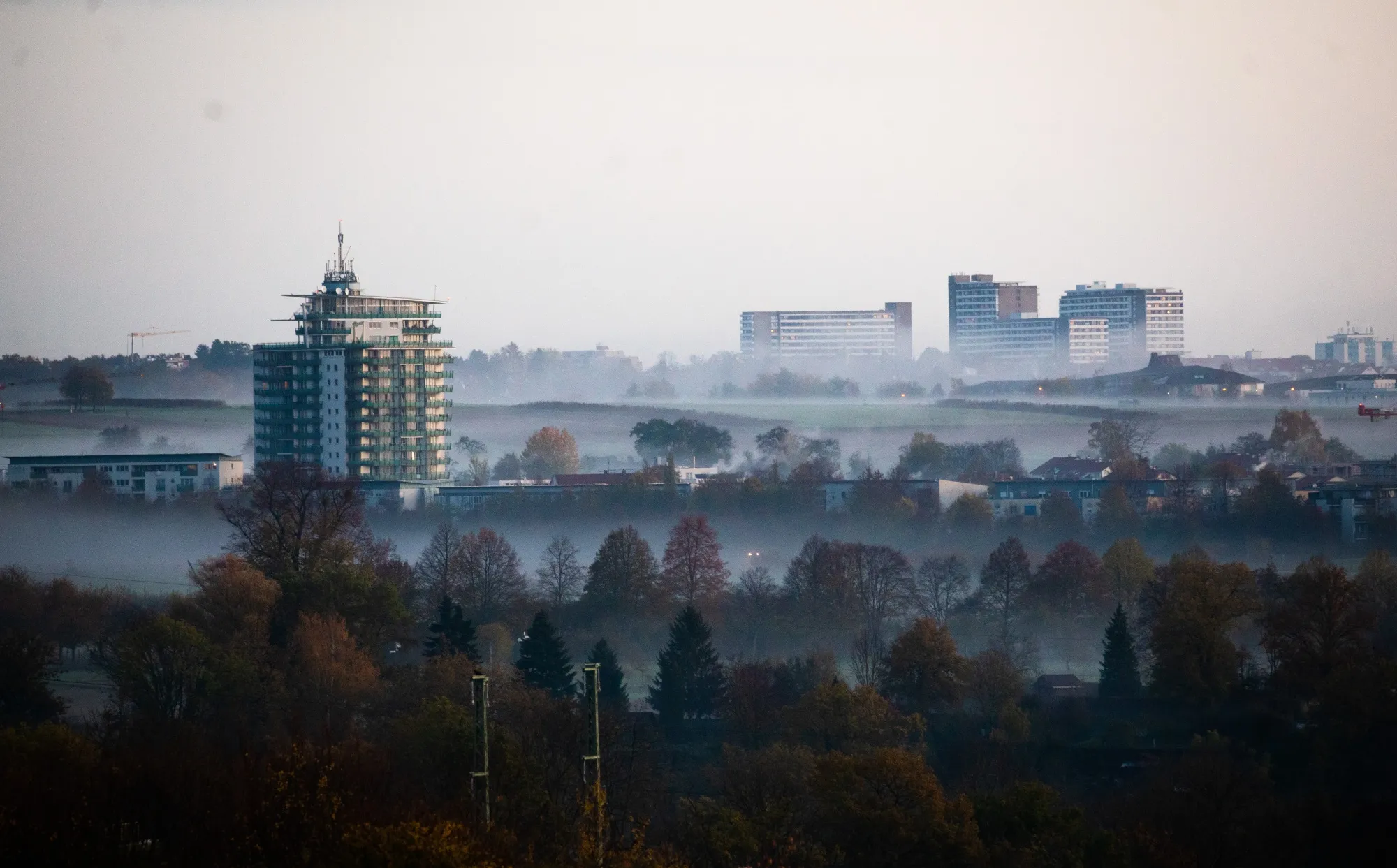 Clouds of fog drift over parts of Stuttgart in the early morning. The city’s topography makes it particularly vulnerable to air pollution build-up.&nbsp;