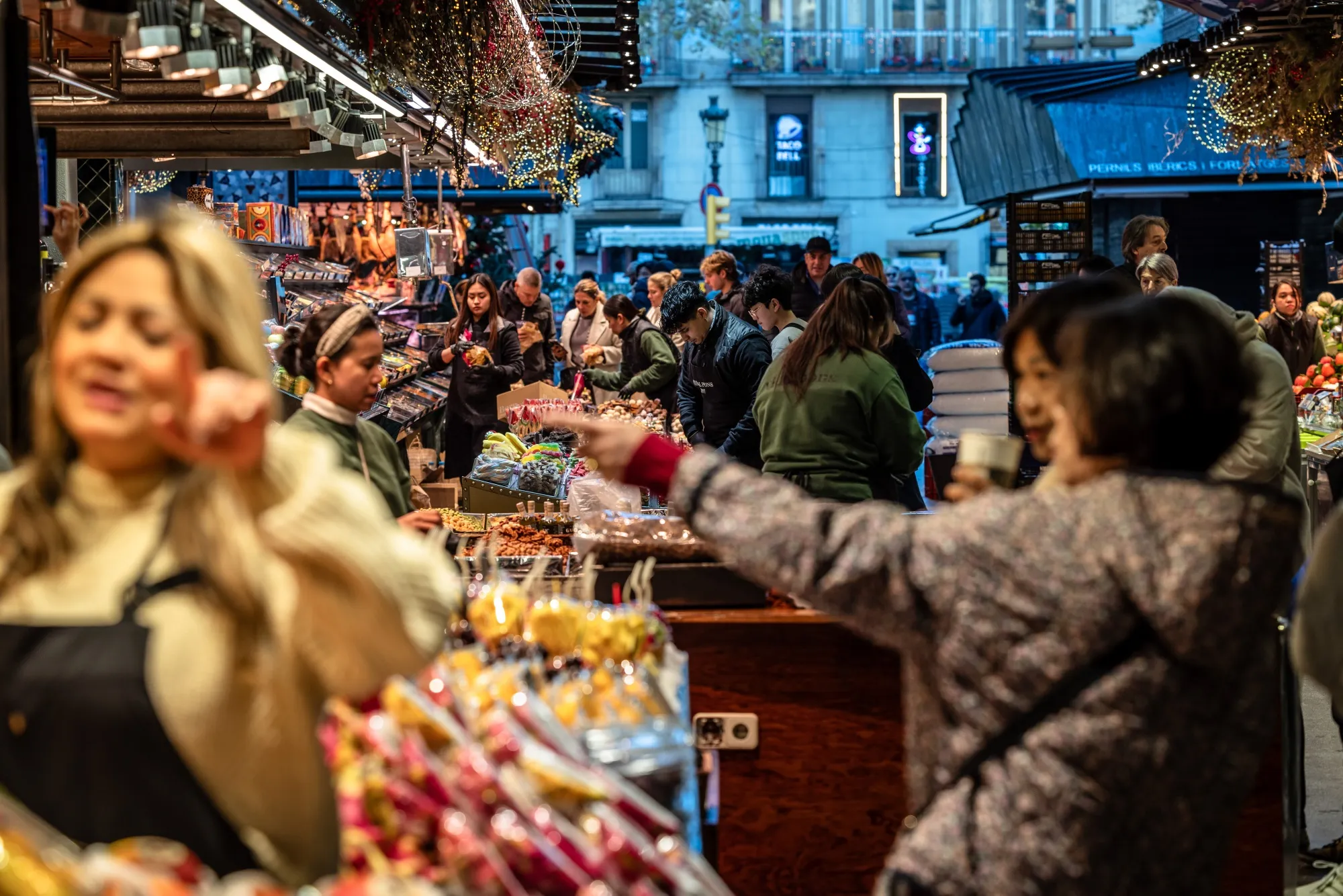 Shoppers at a market in Barcelona.