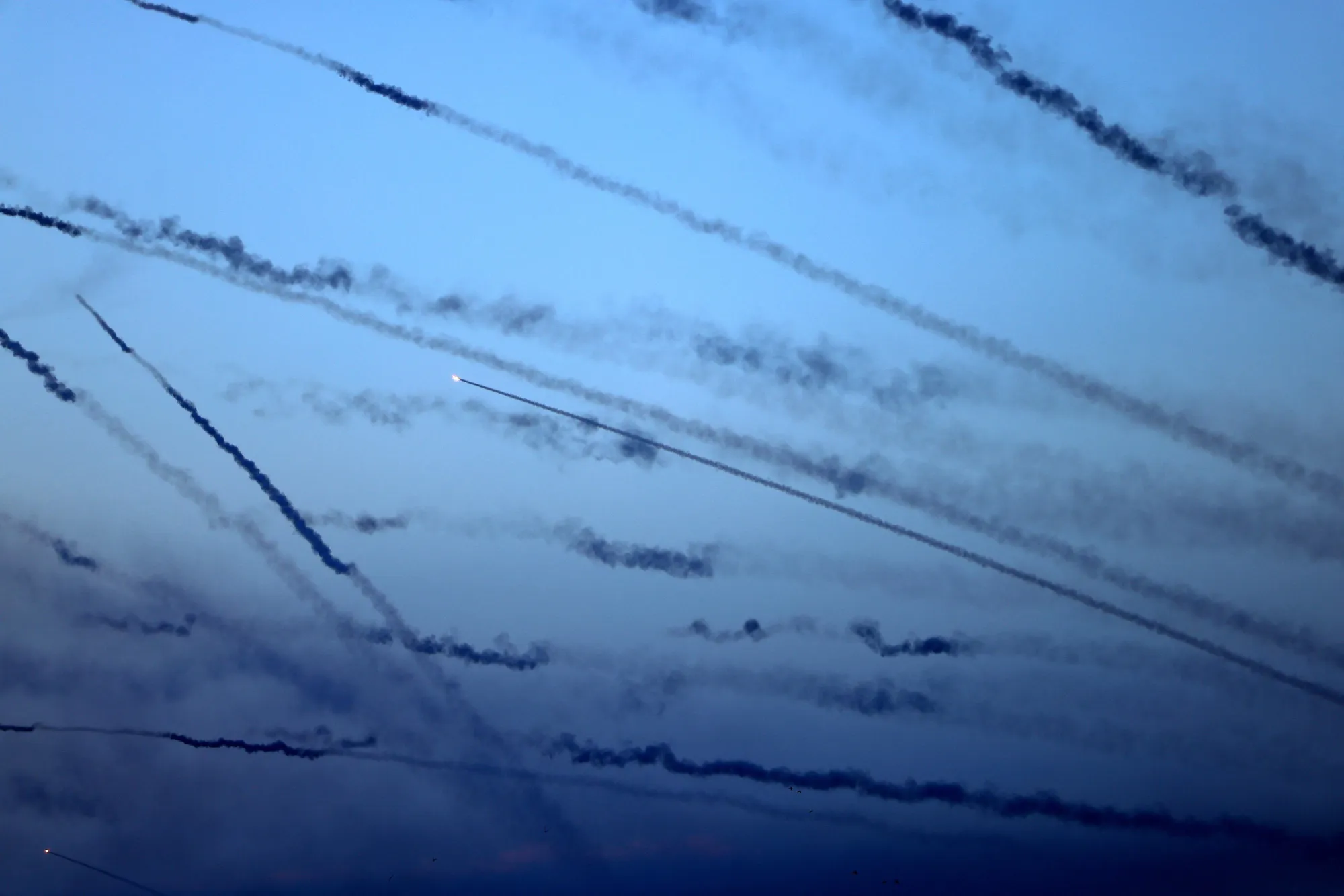Rockets are fired from Gaza City towards Israel, on Oct. 7.
