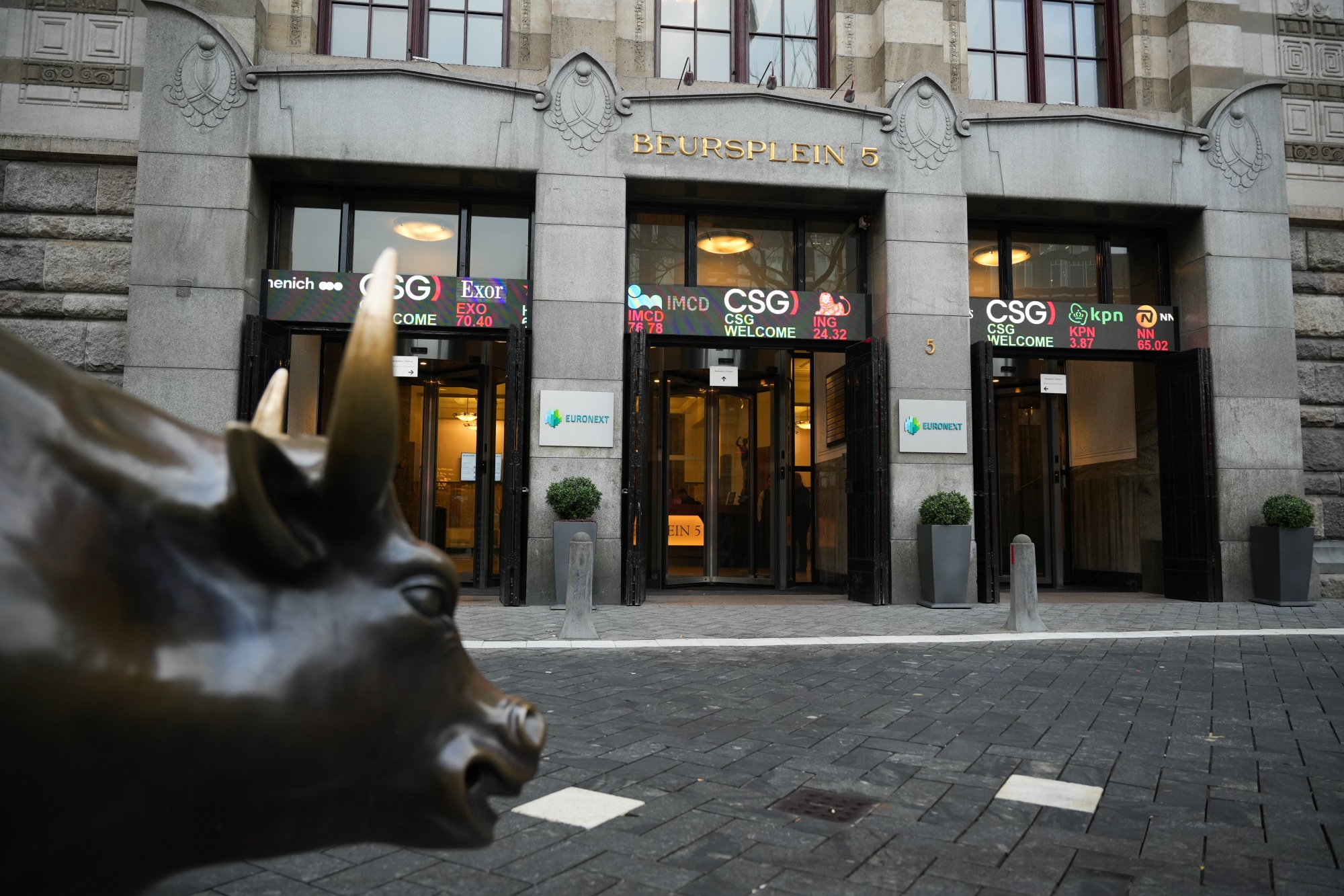 The CSG NV logo on a digital ticker during the listing of their company at Euronext Amsterdam in Amsterdam, Netherlands, on Friday, Jan. 23, 2026. Armored vehicle and munitions maker CSG NV’s shares soared in its Amsterdam trading debut on Friday morning, after the firm and its owner raised €3.3 billion ($3.9 billion) in an initial public offering. Photographer: Lina Selg/Bloomberg