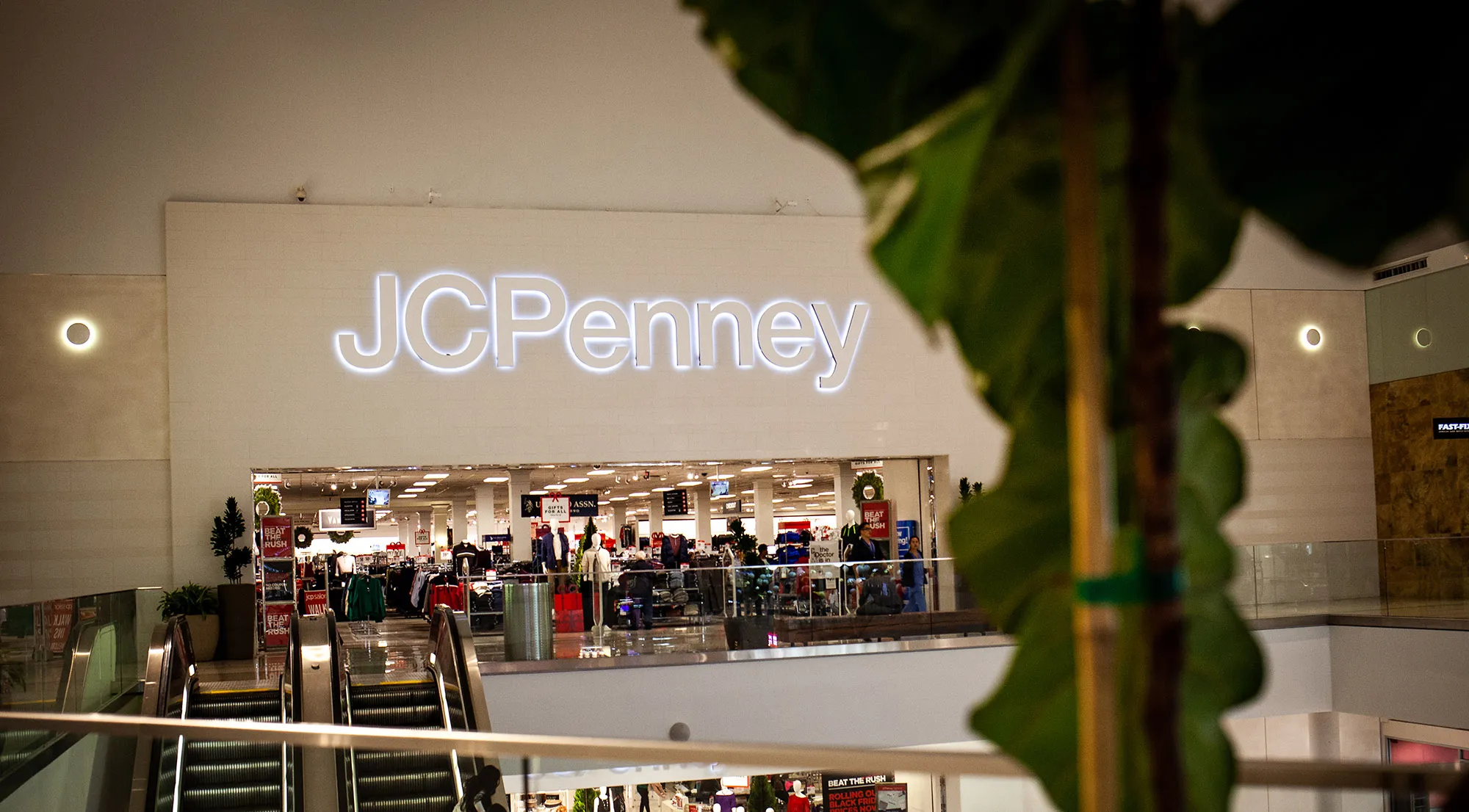Shoppers ride an escalator near a a J.C. Penney store&nbsp;in Culver City, California.