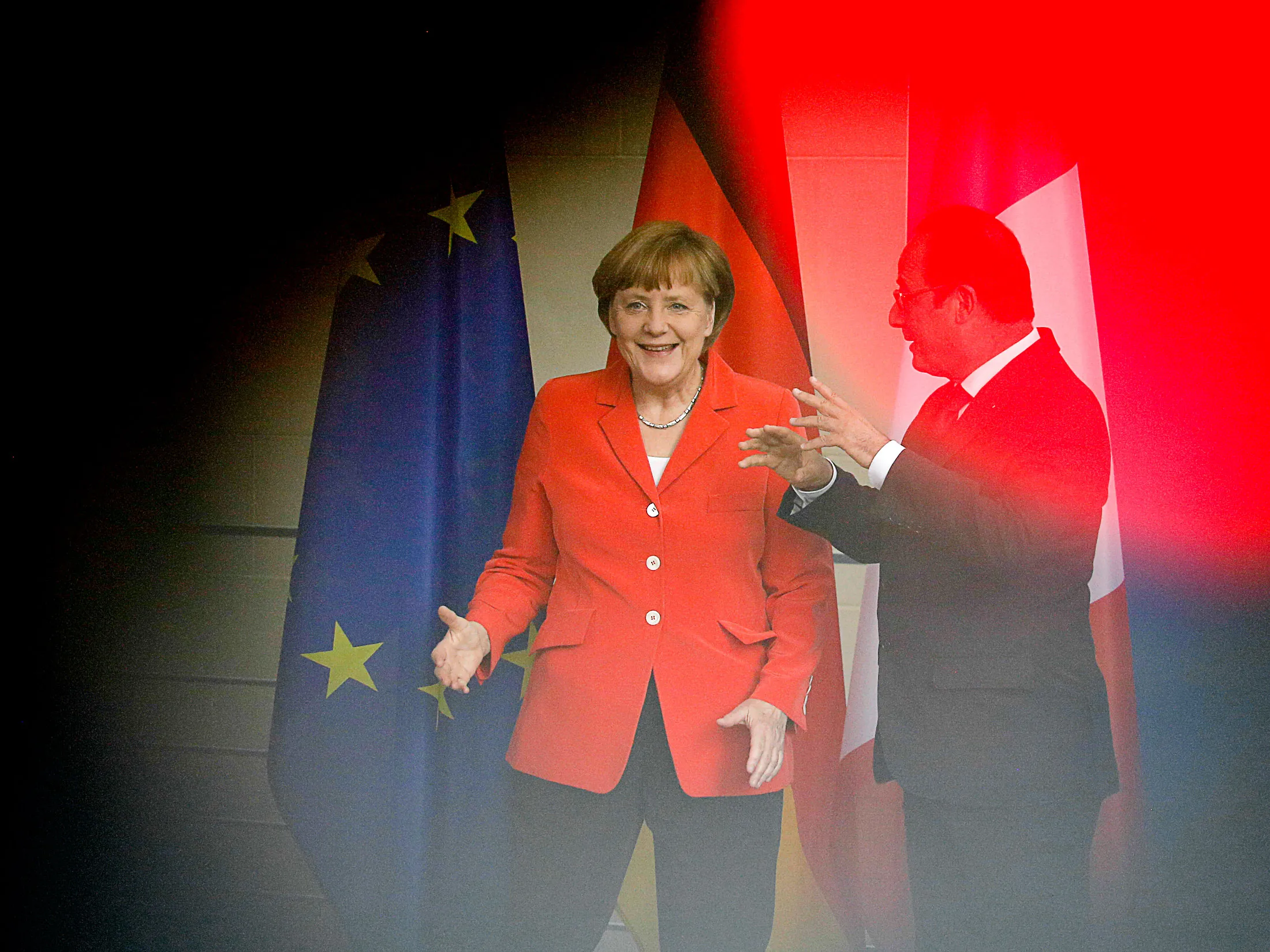 German Chancellor Angela Merkel and French President Francois Hollande leave a news conference after a meeting at the chancellery, in Berlin, on May 19, 2015.
