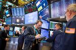 Traders work on the floor of the New York Stock Exchange.