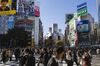 Pedestrians cross an intersection in the Shibuya district of Tokyo, Japan, on Thursday, Nov. 16, 2017. Japan’s economy grew for a seventh straight quarter, its longest expansion since 2001, as a recovery in exports and rising business investment offset a decline in consumer spending.