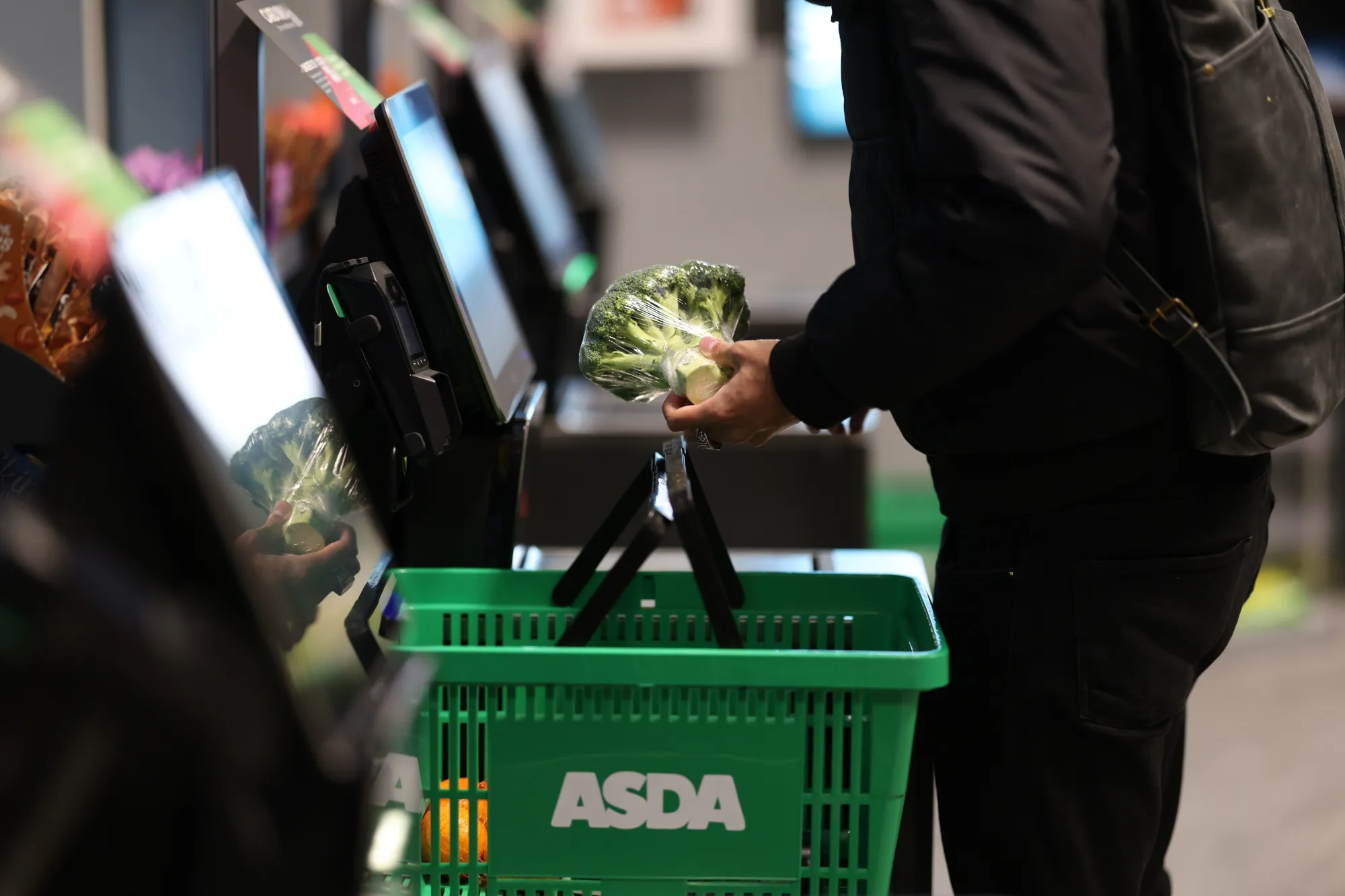 A shopper scans items at the Asda Express convenience store&nbsp;in London, UK.