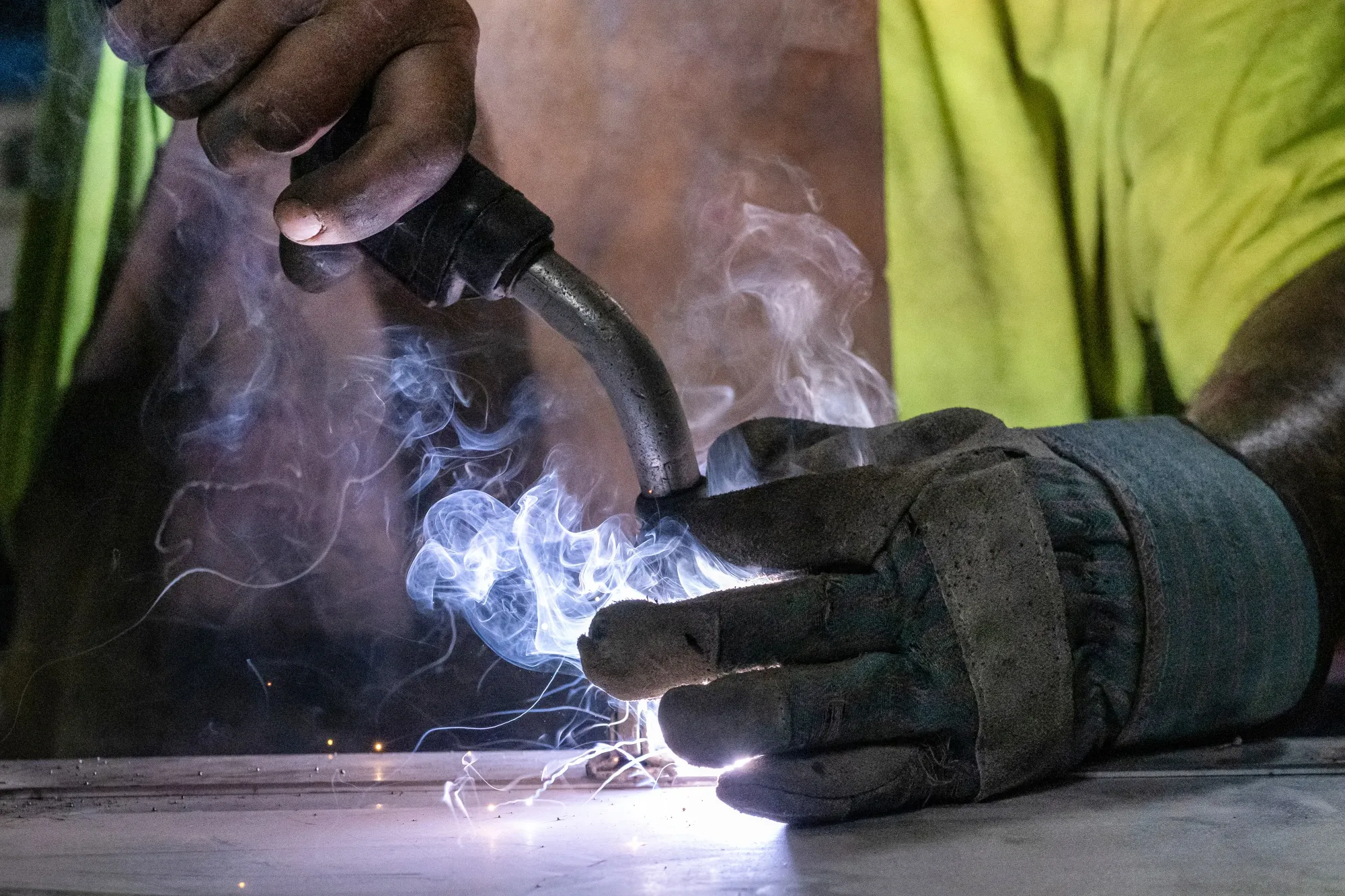 A worker arc welds a metal door&nbsp;in Sacramento, California.