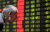 An elderly Chinese investor in front of
