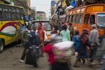 People and matatus on the crowded streets of Nairobi, Kenya.