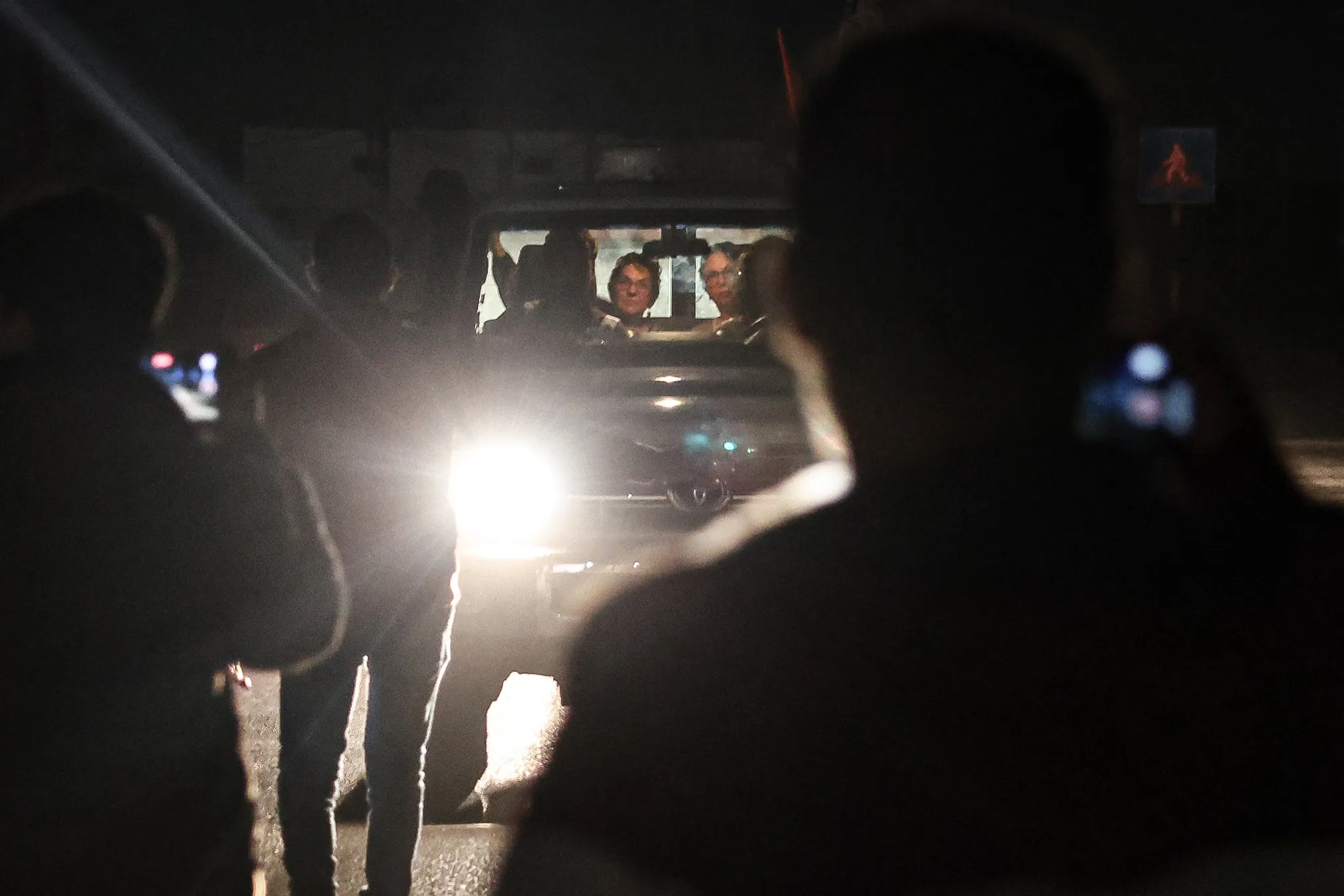 A Red Cross vehicle carrying released hostages drives towards the Rafah border point with Egypt on Nov. 28.