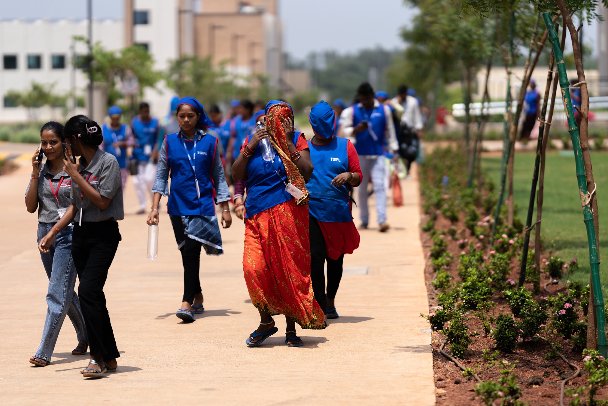 Employees heading to work at Epic Group's manufacturing site in Khordha, Odisha, on June 26. Photographer:&amp;nbsp;Anindito Mukherjee/Bloomberg