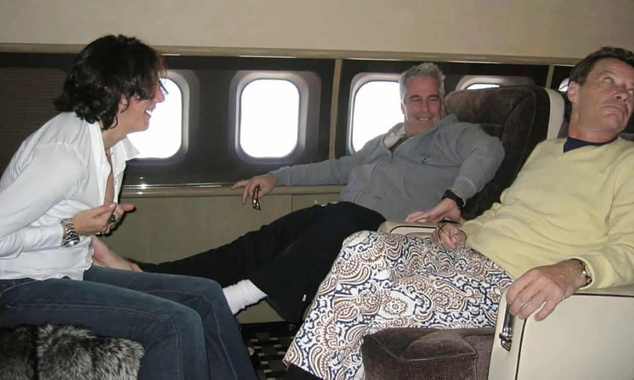 Jean-Luc Brunel, right, on a flight with Jeffrey Epstein and Ghislaine Maxwell.